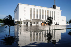 White building and flooded streets