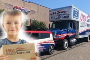 Boy smiling in front of USA Family Moving vehicles